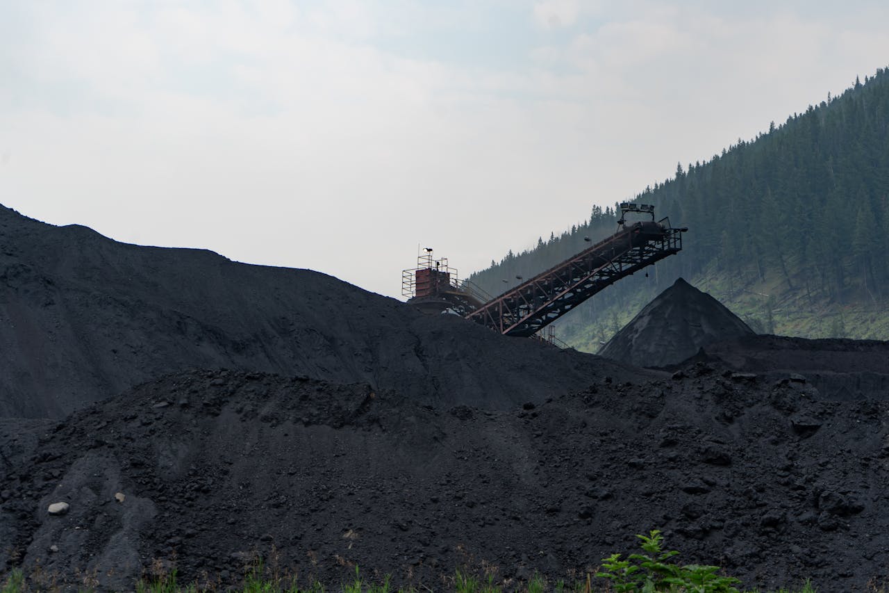 our-story-02 Industrial coal processing facility in Elkford, Canada with large coal piles.